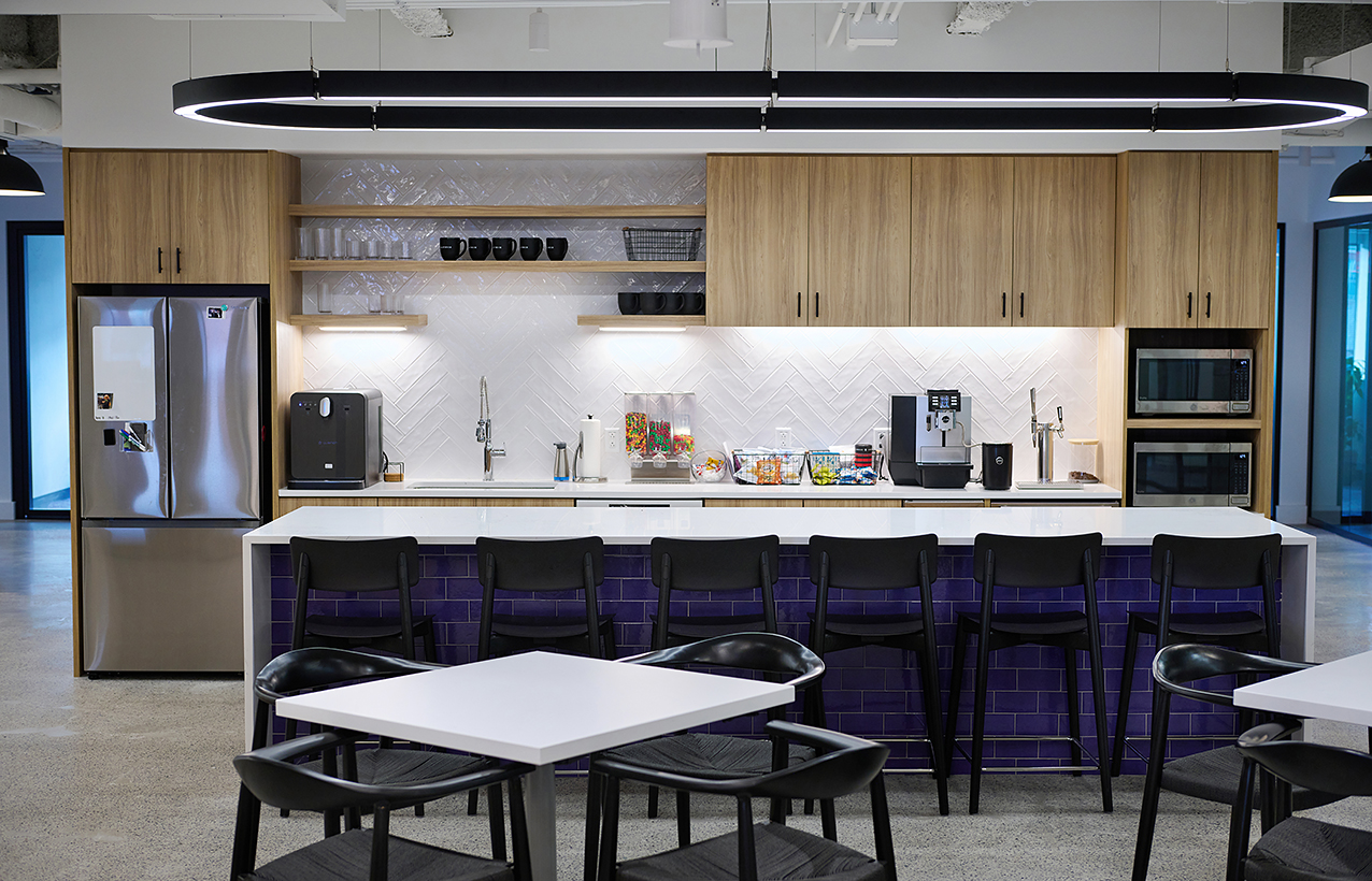 A straight on shot of the break area and kitchen in the office at the Easy Mile Fitness headquarters in Boston, Massachusetts